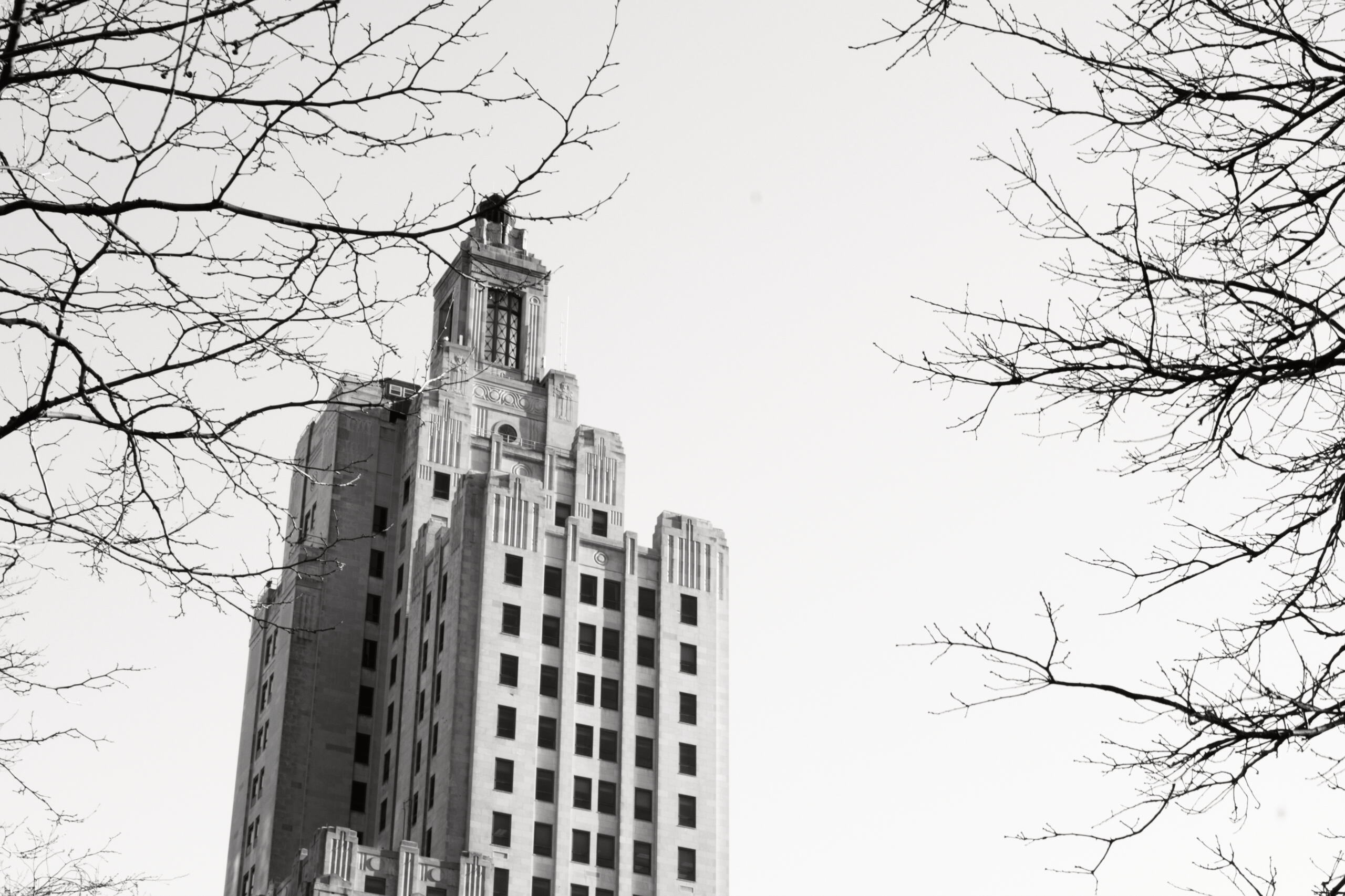 A black and white photo of the Industrial National Bank building in Providence